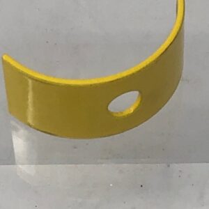 A Plate Tuber Upper, Yellow with a hole in it.
