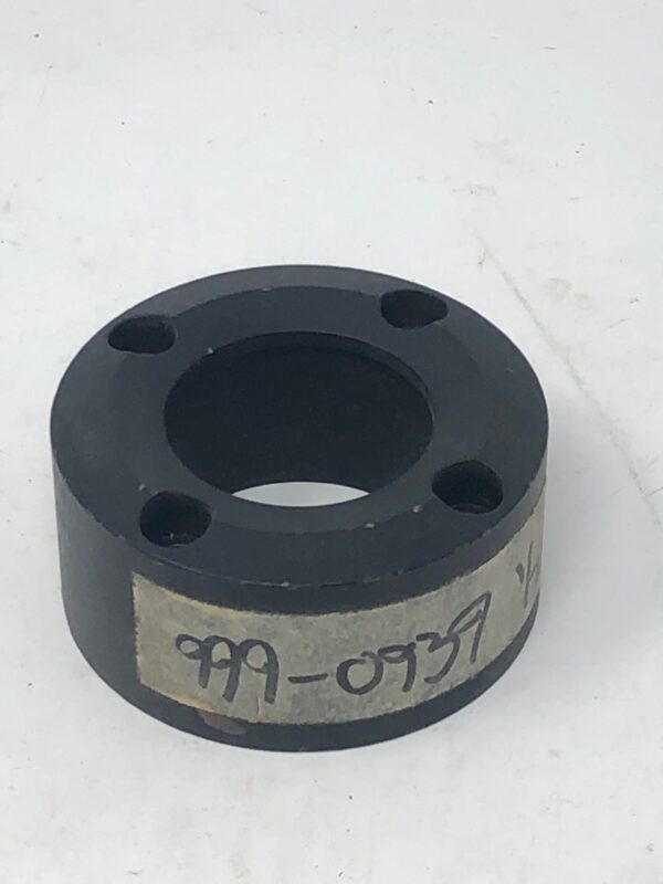 A black [Bushing] on a white surface.