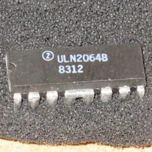 A small ULN2064B IC on a piece of cloth.