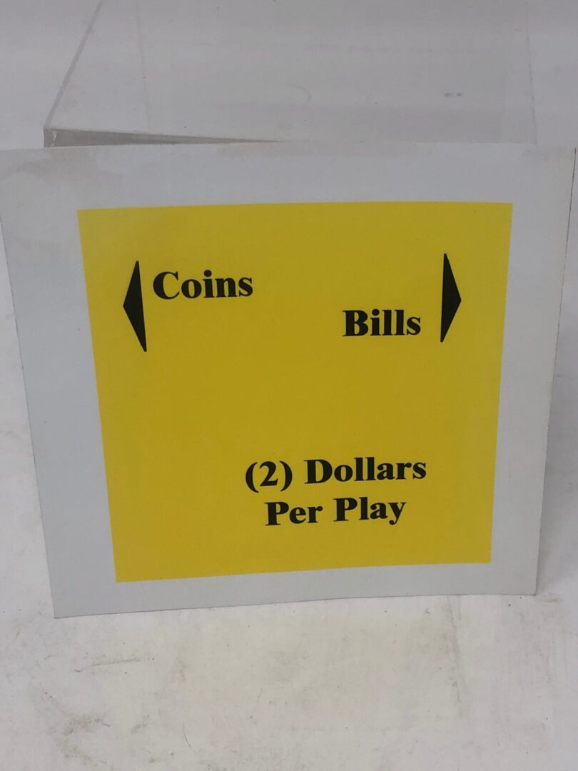 A sign that says coins bills Decal, Denom w/DBA (DOC) per play.