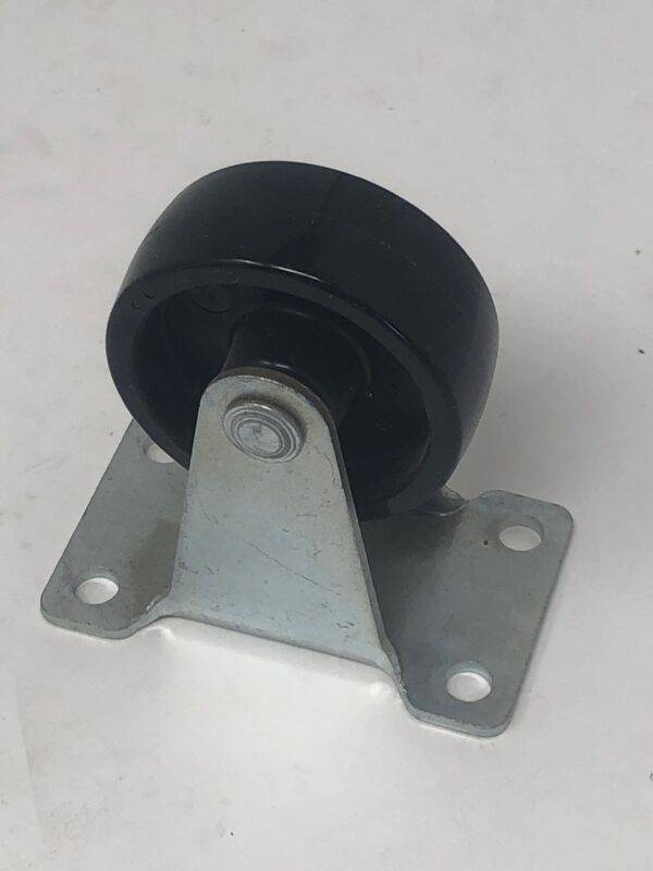 A black plastic Caster on a white surface.