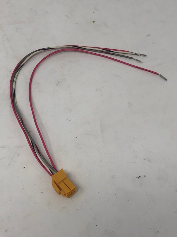 A yellow and black Wire Harness on a white surface.