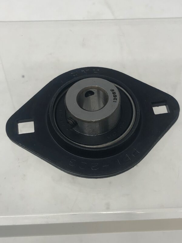 A black Bearing 12, TX flange mounted on a clear plastic base.