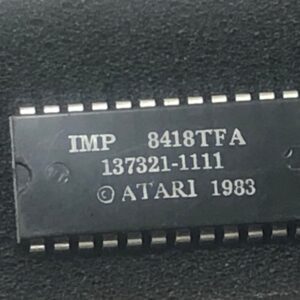 An Atari Custom IC with the word Atari on it.