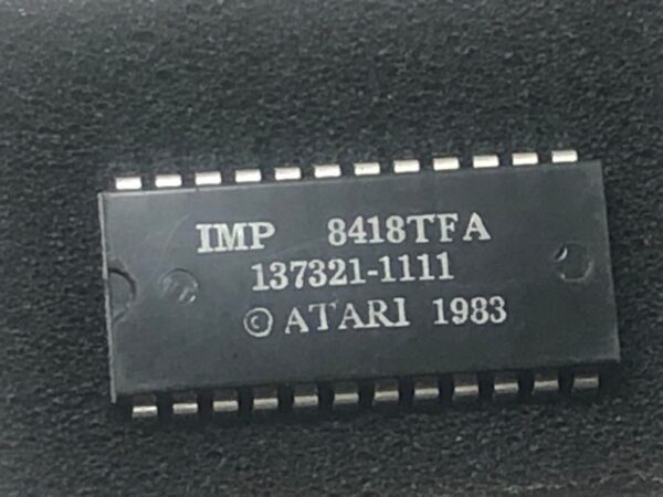 An Atari Custom IC with the word Atari on it.