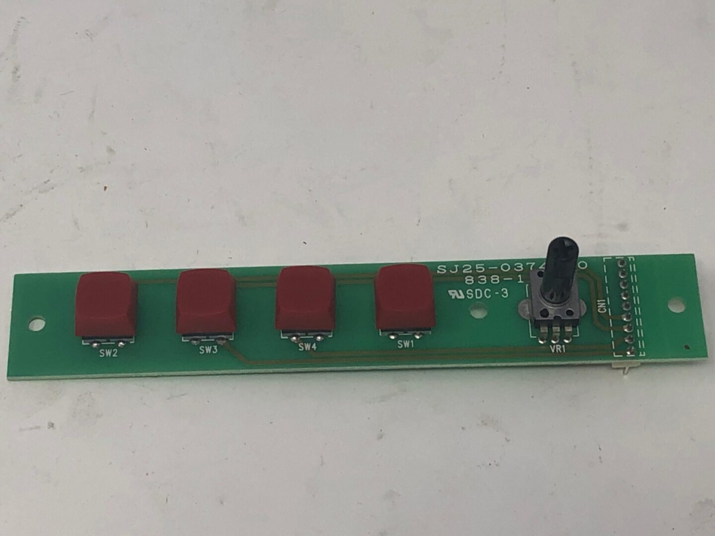 A Switch Board with four red buttons on it.