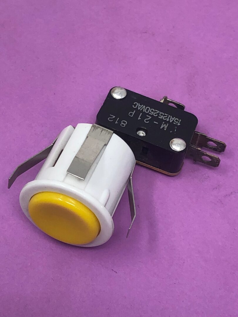 A Yellow Button White Housing switch on a purple background.