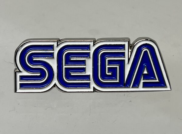 Sega Logo Lapel Pin on a gray background.